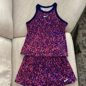 Orange and blue 2 piece Nike active wear for tennis, golf, or everyday.